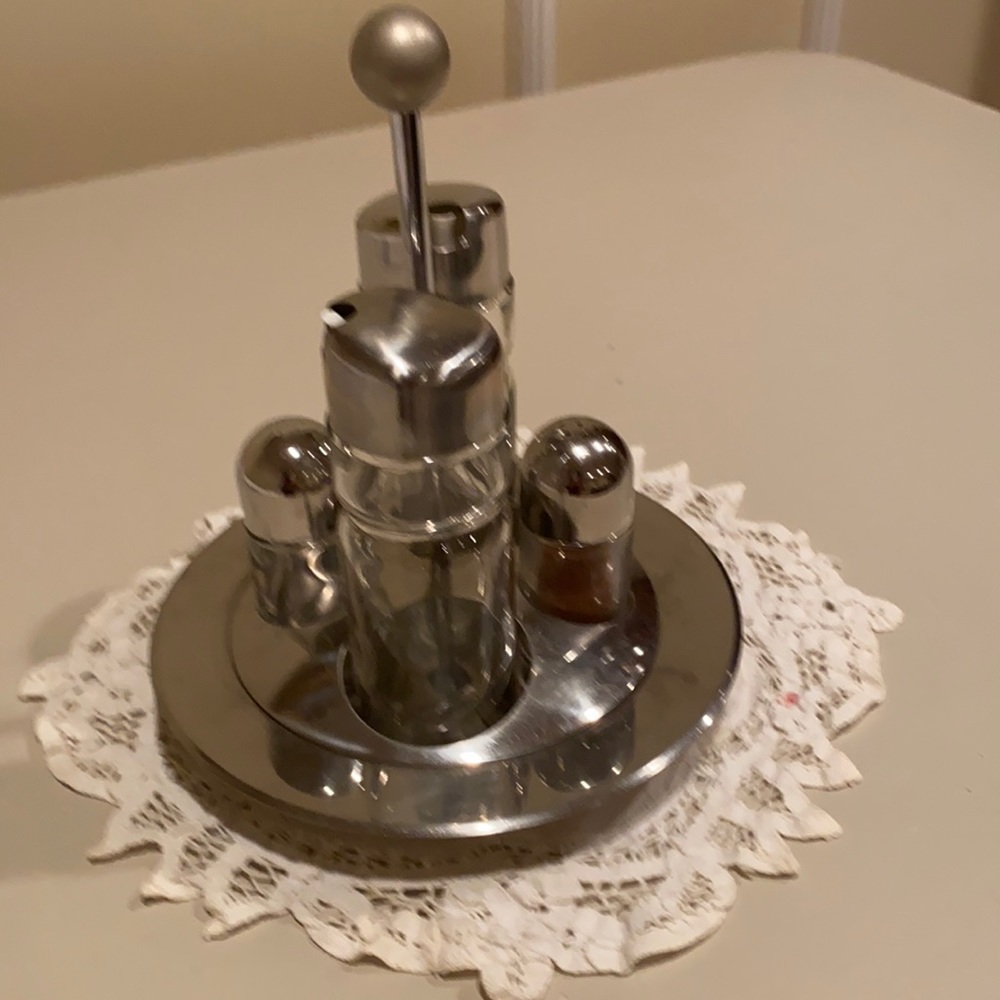 Salt and pepper shaker with lemon and oil bottles